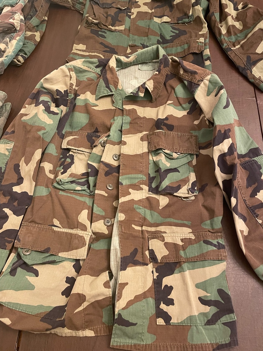 2 Camo Utility Shirts or Jackets, 1 pair of camo shorts & 1 camo backpack!